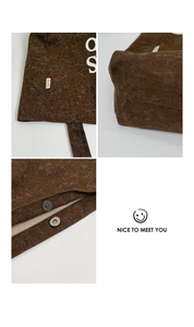 Close-up of leopard print canvas tote bag texture, magnetic buckle and fine stitching