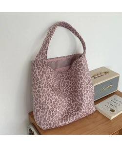 Detail of leopard print tote bag interior pocket and spacious canvas compartment