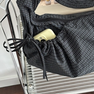 Large capacity black and white checkered canvas croissant bag with drawstring closure
