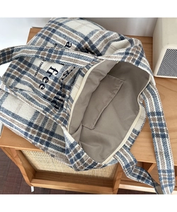 Detail view of the vintage plaid tote bag with zipper closure and interior storage pocket
