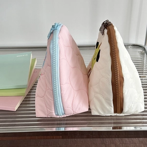 Quilted triangle cosmetic bags with cute animal embroidery and colorful chunky zippers