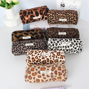 Variety of leopard print pouches in different colors showing soft fabric texture and zipper