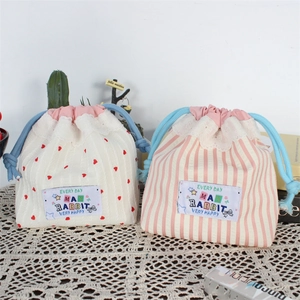 Cute drawstring makeup pouches with lace frills in heart and stripe patterns