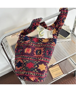 Close-up of vintage geometric pattern on a plush knit tote bag with thick texture