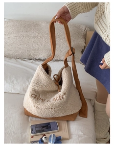 Detail of plush lamb wool tote bag with Crème Glacée embroidery and brown strap
