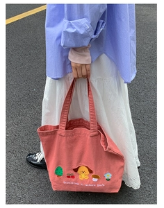 Detailed pink canvas tote featuring colorful puppy embroidery and nature park text