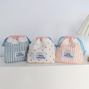 Lace-trimmed drawstring bags with cute patterns for travel toiletries storage