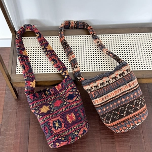 Vintage plush bucket bags with colorful ethnic patterns and wide shoulder straps