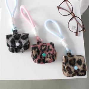 Plush leopard print earphone case in pink grey and brown with long braided lanyards