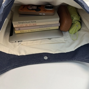 Top view of large capacity vintage denim tote bag showing interior storage and pockets