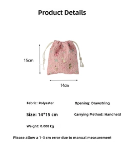 Detailed view of pink quilted drawstring bag with cartoon rabbit and bear prints
