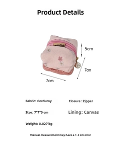 Pink corduroy mini pouch with floral embroidery, pearl zipper and 7x7x5cm size detail