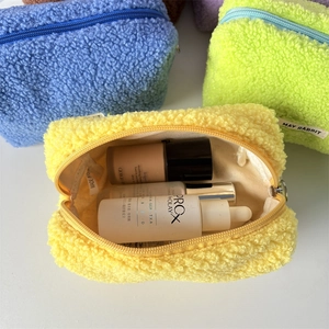 Detail of plush teddy fleece pencil bags in vibrant colors showing storage capacity