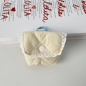 Detailed close-up of a quilted floral earphone case featuring delicate white lace trim and blue hook