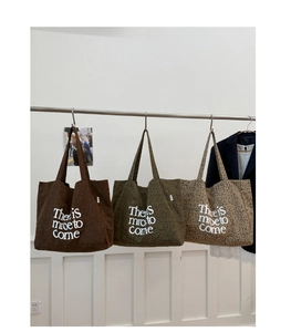 Detailed corduroy tote bags in brown, olive green, and leopard print with white slogan