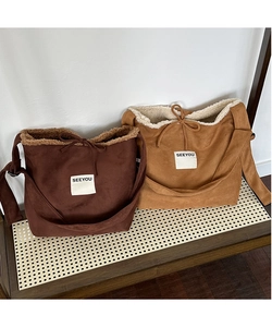 Detailed view of suede shoulder bags with soft fleece lining and Seeyou patch logo