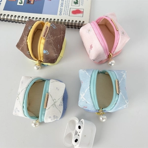 Floral cotton earphone cases in four colors with pearl zippers and zipper closure