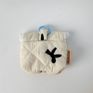 Detailed view of quilted cotton earphone case with lace trim and blue hanging clip
