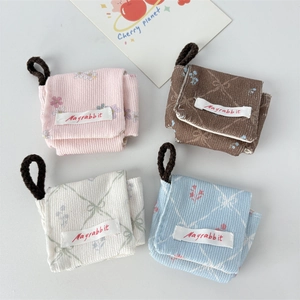 Corduroy mini storage pouches in pink, brown, beige, and blue with floral patterns