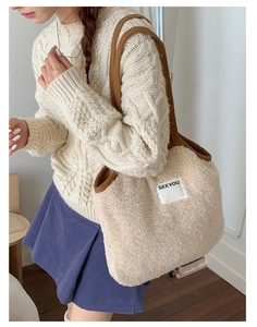 Detail of beige faux fur crossbody bag with SEEYOU patch and brown wide strap