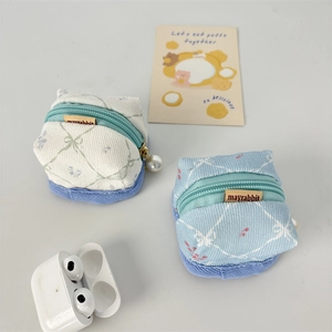 Canvas earphone pouch with quilted pattern, metal zipper and pearl charm detail
