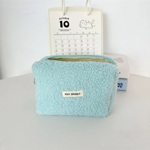 Detail of the soft blue teddy fleece texture and brand label on this large pencil case