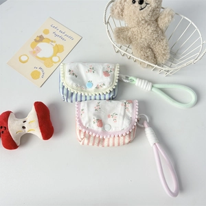Floral padded quilted pouch with stripes and pom-pom for earphones and small accessories