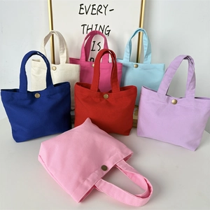 Minimalist canvas tote bags in seven colors with metal snap closure for women