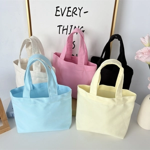 Minimalist solid canvas handbag set in five colors including blue pink and black