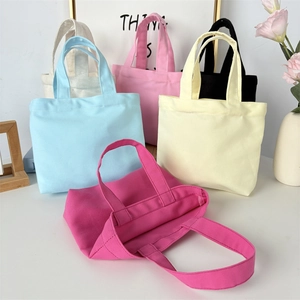 Close-up of high-quality canvas tote bags in multiple colors with sturdy handles