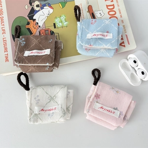 Detailed corduroy headphone pouches in four colors with decorative magazine and lanyard