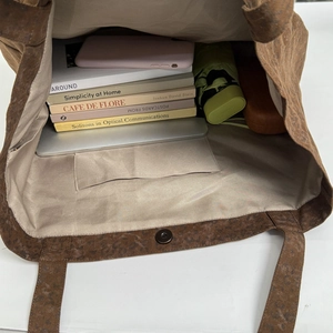 Large capacity leopard print tote bag showing spacious interior for laptop and books