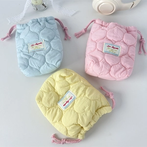 Quilted heart camera storage pouch in pastel colors with drawstring closure and soft padding