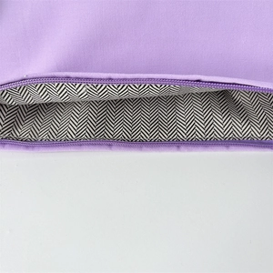 Detailed close-up of canvas makeup bag with durable zipper and herringbone lining