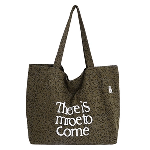 Large leopard print canvas tote bag with letter print and minimalist aesthetic