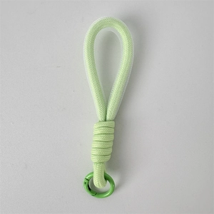 Detail of avocado green woven lanyard with durable metal spring ring for accessories