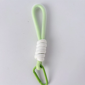 Close-up of light green floral pouch lanyard with a durable metal carabiner clip