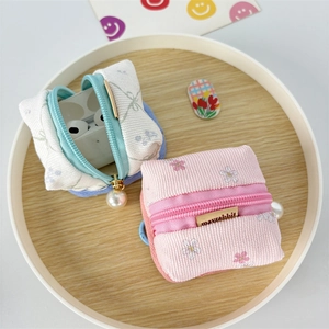 Floral corduroy earphone case pouches with pearl charms and Mayrabbit brand label