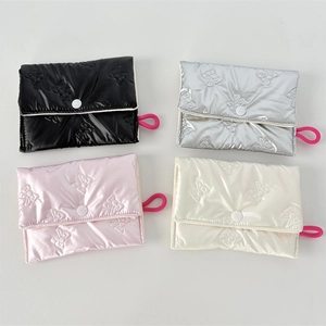 Puffy quilted mini pouches with bow embossing in black, silver, pink, and beige
