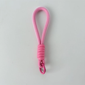 Close-up of pink braided nylon lanyard with matching metal carabiner and reinforced knot