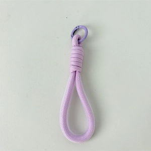 Detail of purple woven rope keychain with sturdy circular metal spring clip fastener