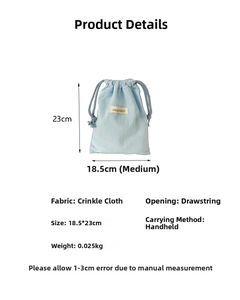 Sky blue crepe fabric drawstring bag with size 18.5x23cm and brand tag details