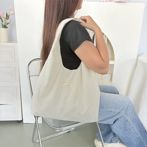 Polka dot canvas tote bag for women, large capacity shoulder bag shown in home setting