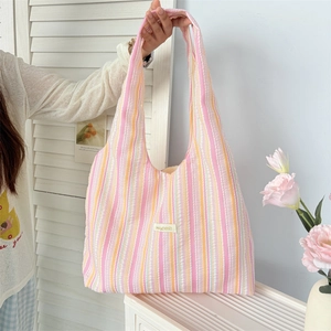Pink and orange rainbow striped tote bag made of seersucker fabric for casual daily use