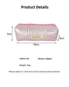 Pink PU pencil case with bow embossing and zipper closure measuring 19x7x6cm