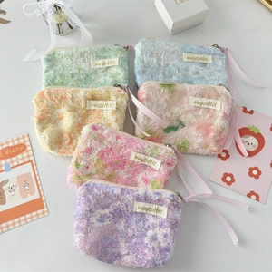 Set of 6 cute floral lace pouches in pastel colors with zippers and ribbon handles