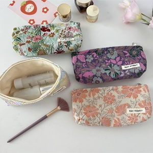 French jacquard floral makeup bags set for travel in pastel green, purple, and pink colors
