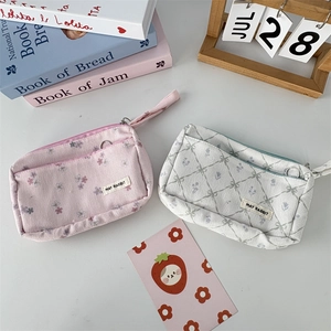 Detailed corduroy pencil case showing double-layered floral and diamond patterns