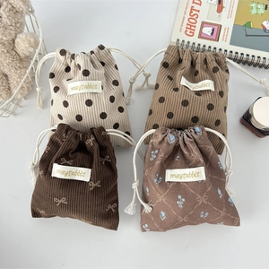 Mini corduroy drawstring bags in four cute patterns including dots and floral prints