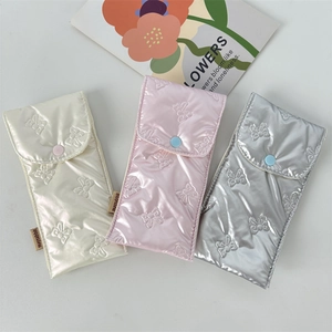 Quilted bow pencil cases in white, pink and silver colors with snap button closure